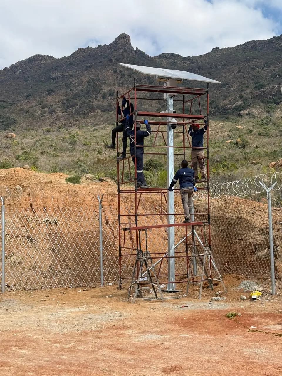KBSK technicians installing surveillance equipment at a remote site