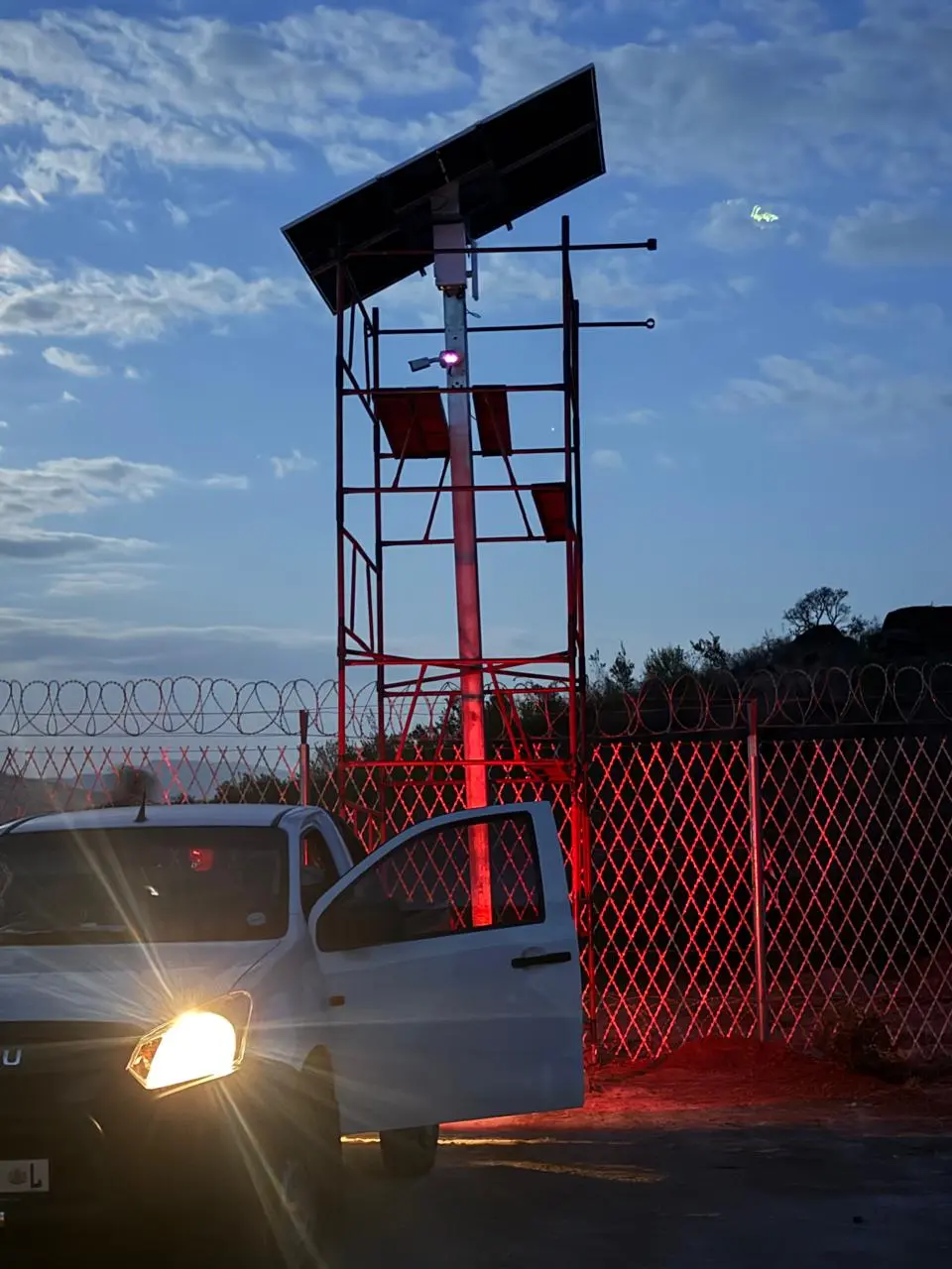 Close view of solar-powered surveillance equipment mounted on a pole
